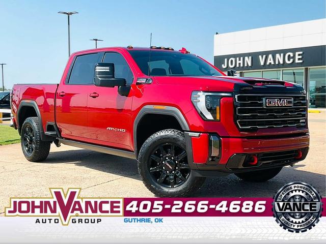 Photo of 2024 Volcanic Red Tintcoat GMC Sierra 2500