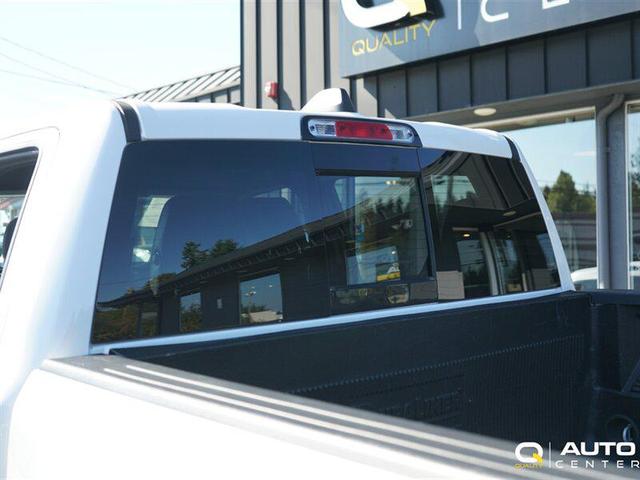 Photo of 2023 Ivory Tri-Coat Pearl RAM 1500