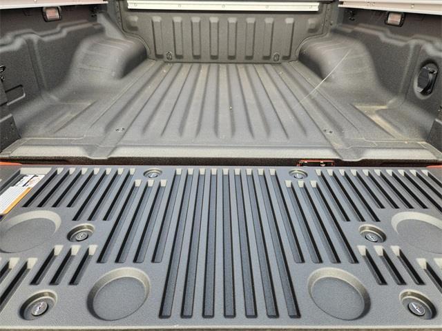 Photo of 2025 Afterburn Orange Nissan Frontier