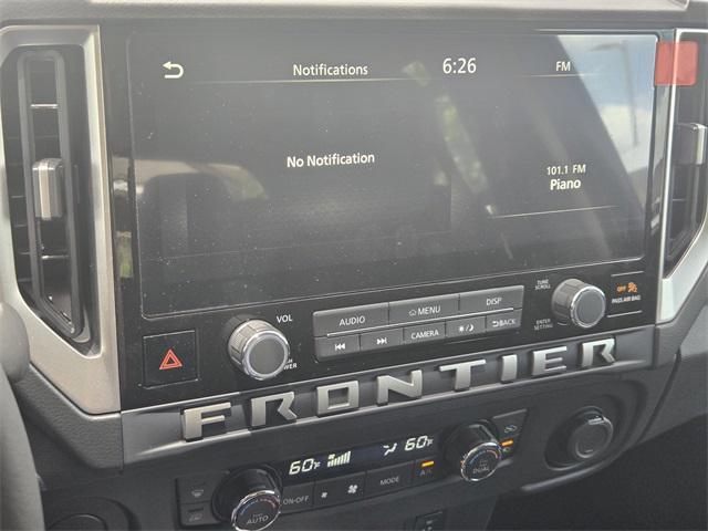 Photo of 2025 Glacier White Nissan Frontier
