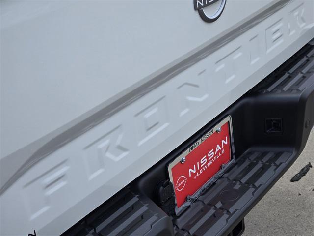 Photo of 2025 Glacier White Nissan Frontier