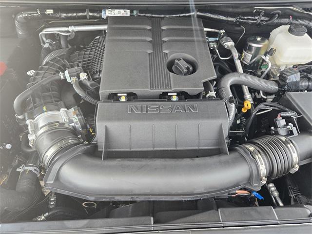 Photo of 2025 Glacier White Nissan Frontier