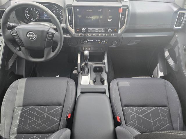 Photo of 2025 Glacier White Nissan Frontier
