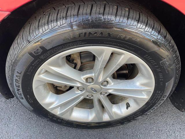 Photo of 2013 Ruby Red Metallic Tinted Clearcoat Ford Taurus