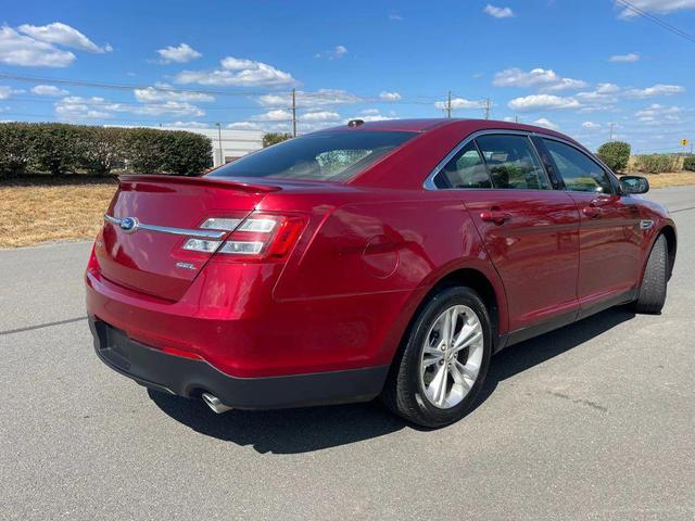 Photo of 2013 Ruby Red Metallic Tinted Clearcoat Ford Taurus