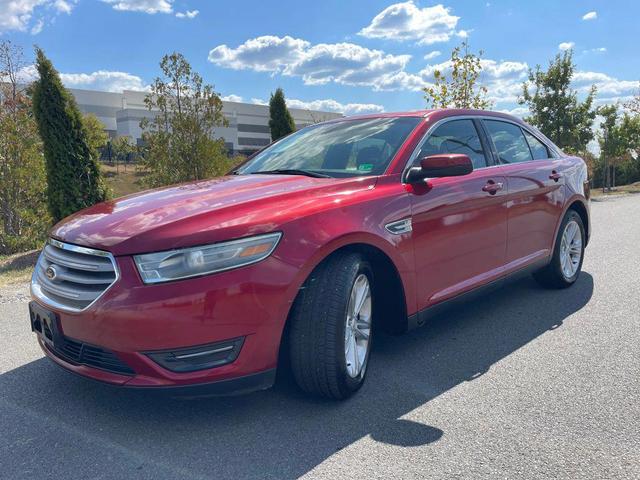 Photo of 2013 Ruby Red Metallic Tinted Clearcoat Ford Taurus