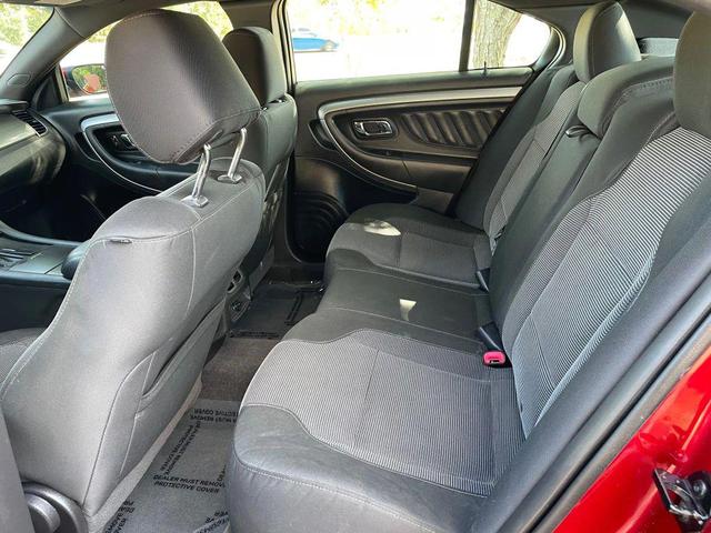 Photo of 2013 Ruby Red Metallic Tinted Clearcoat Ford Taurus