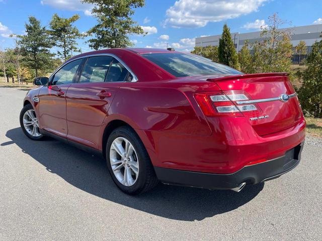 Photo of 2013 Ruby Red Metallic Tinted Clearcoat Ford Taurus