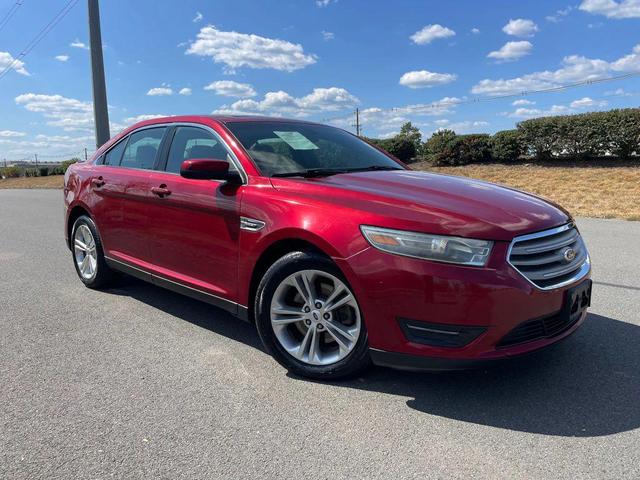 Photo of 2013 Ruby Red Metallic Tinted Clearcoat Ford Taurus