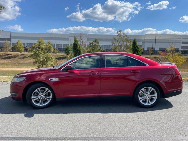 Photo of 2013 Ruby Red Metallic Tinted Clearcoat Ford Taurus