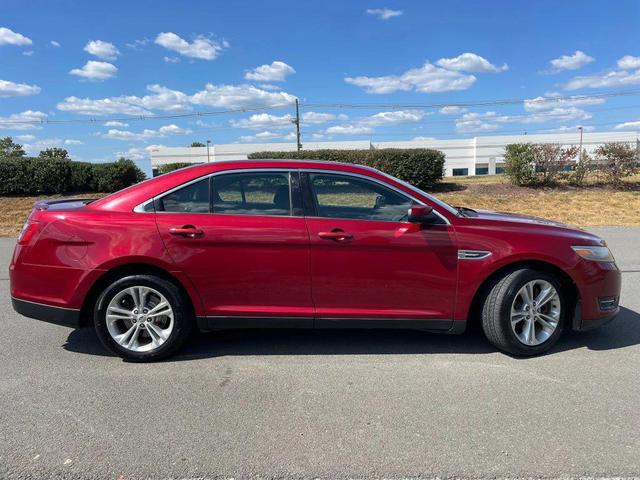 Photo of 2013 Ruby Red Metallic Tinted Clearcoat Ford Taurus