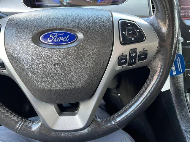 Photo of 2013 Ruby Red Metallic Tinted Clearcoat Ford Taurus