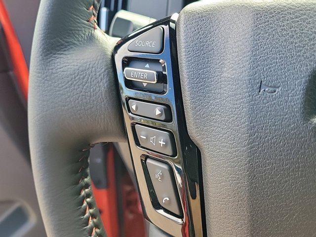 Photo of 2025 Afterburn Orange Nissan Frontier