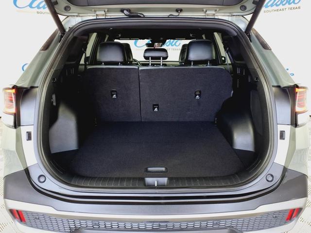 Photo of 2023 Jungle Green/Ebony Black Roof Kia Sportage