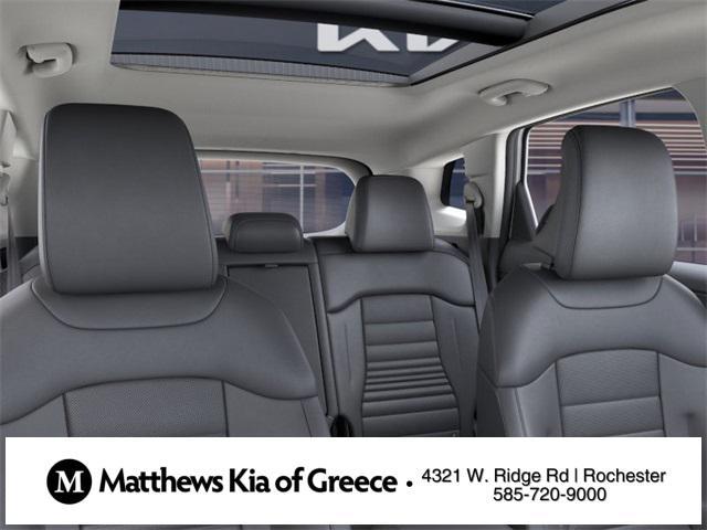 Photo of 2025 White Pearl Kia Sportage Hybrid