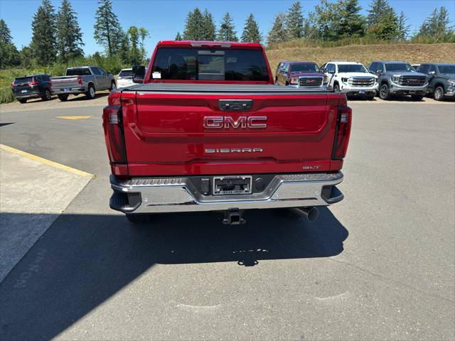 Photo of 2025 Volcanic Red Tintcoat GMC Sierra 2500