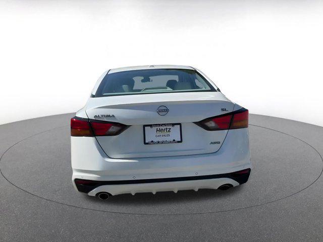 Photo of 2024 Pearl White Tricoat Nissan Altima