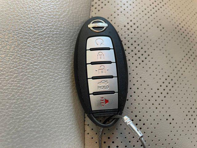 Photo of 2024 Pearl White Tricoat Nissan Altima