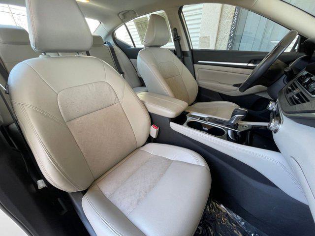 Photo of 2024 Pearl White Tricoat Nissan Altima