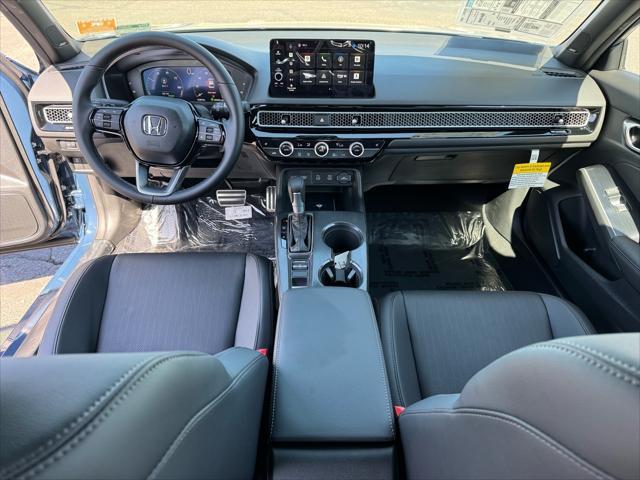 Photo of 2025 Boost Blue Pearl Honda Civic Hybrid
