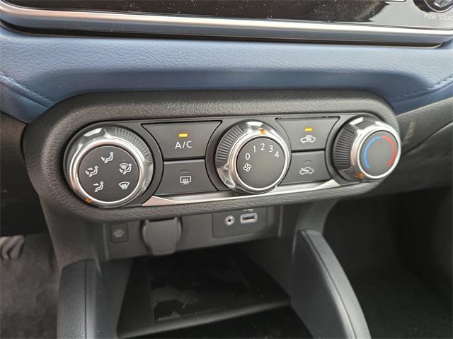 Photo of 2025 Scarlet Ember Tintcoat Nissan Versa