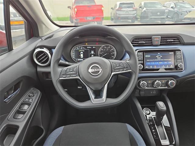 Photo of 2025 Scarlet Ember Tintcoat Nissan Versa