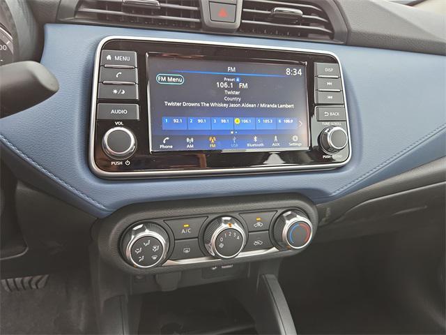 Photo of 2025 Scarlet Ember Tintcoat Nissan Versa