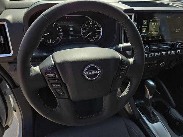Photo of 2025 Glacier White Nissan Frontier