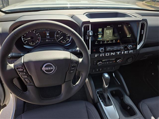Photo of 2025 Glacier White Nissan Frontier