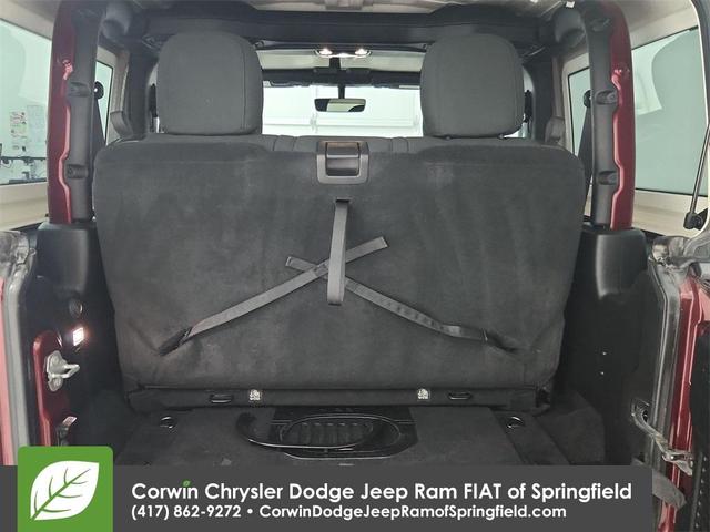 Photo of 2021 Snazzberry Pearlcoat Jeep Wrangler