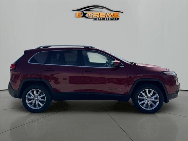 Photo of 2016 Deep Cherry Red Crystal Pearlcoat Jeep Cherokee