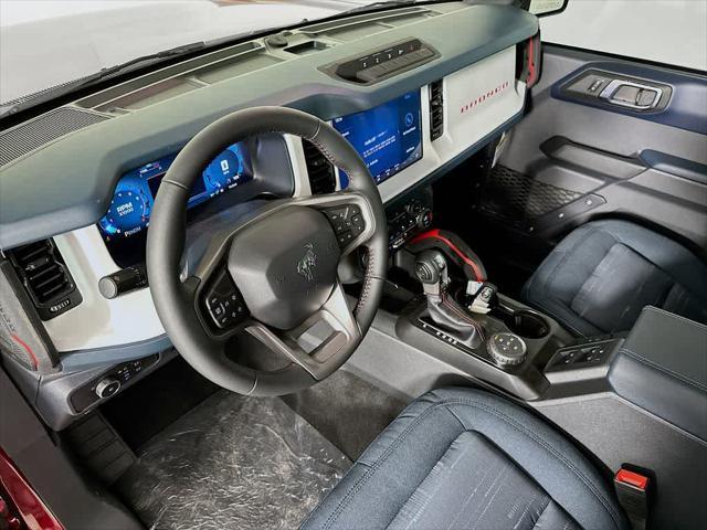 Photo of 2025 Ruby Red Metallic Tinted Clearcoat Ford Bronco