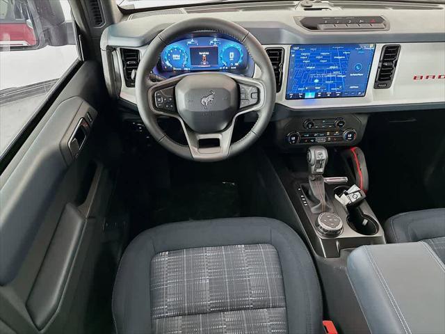 Photo of 2025 Ruby Red Metallic Tinted Clearcoat Ford Bronco