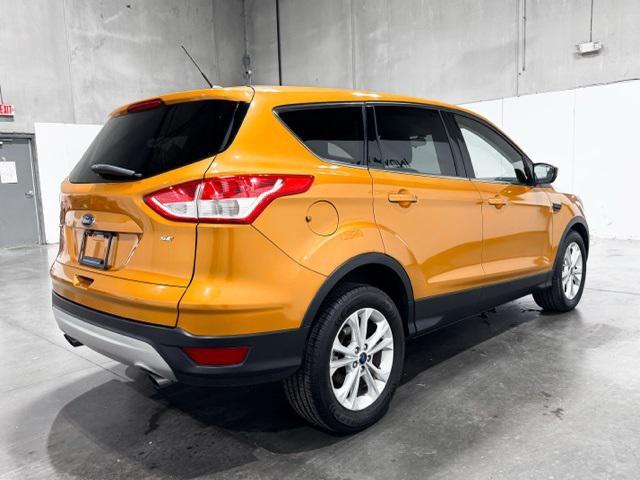 Photo of 2016 Electric Spice Metallic Ford Escape