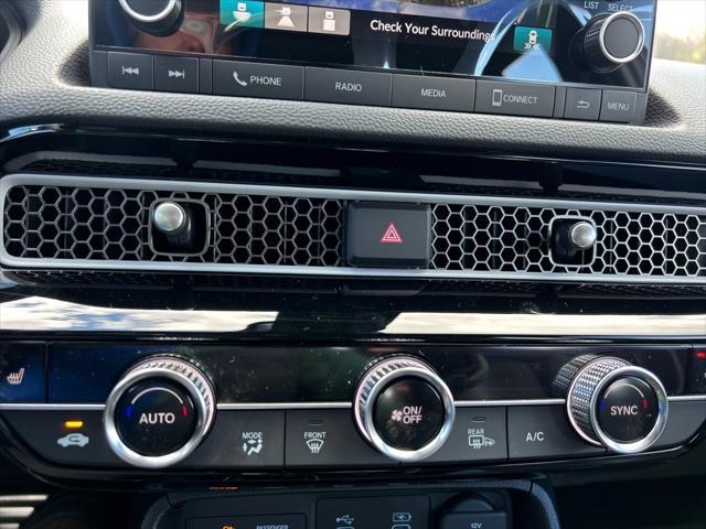 Photo of 2025 Boost Blue Pearl Honda Civic Hybrid