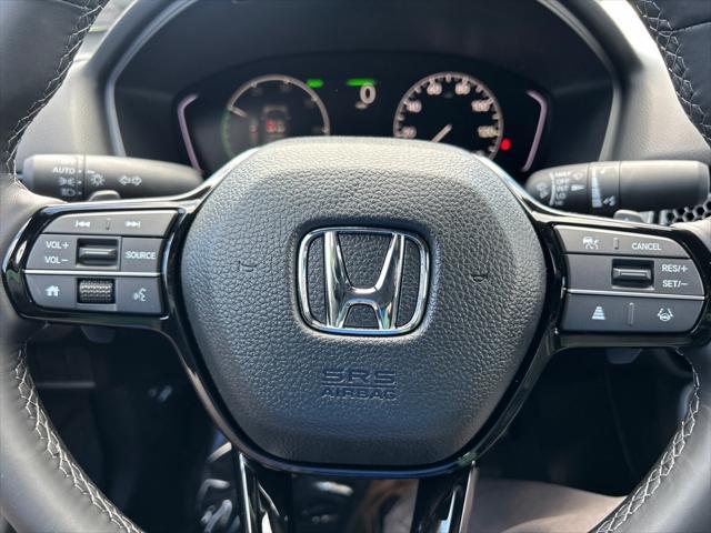 Photo of 2025 Boost Blue Pearl Honda Civic Hybrid