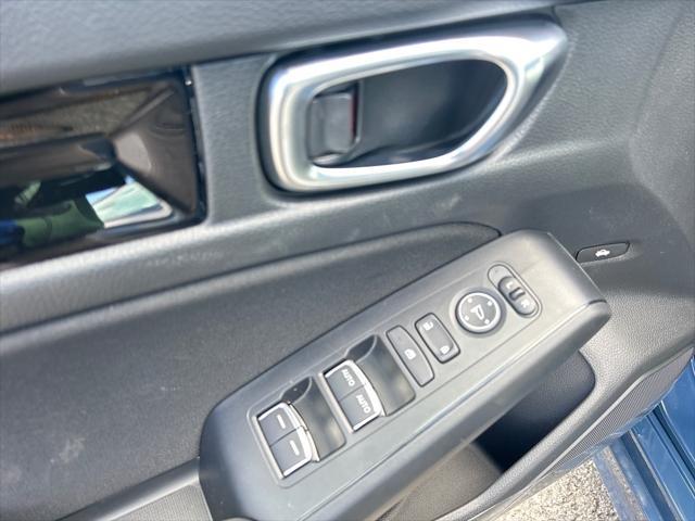 Photo of 2025 Boost Blue Pearl Honda Civic Hybrid
