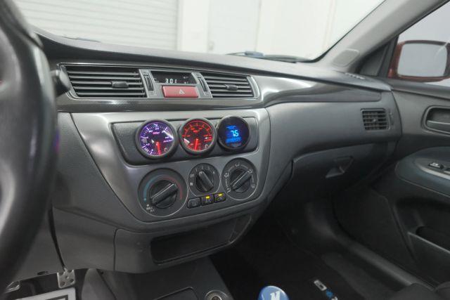 Photo of 2006 Rotor Glow Metallic Mitsubishi Lancer Evolution