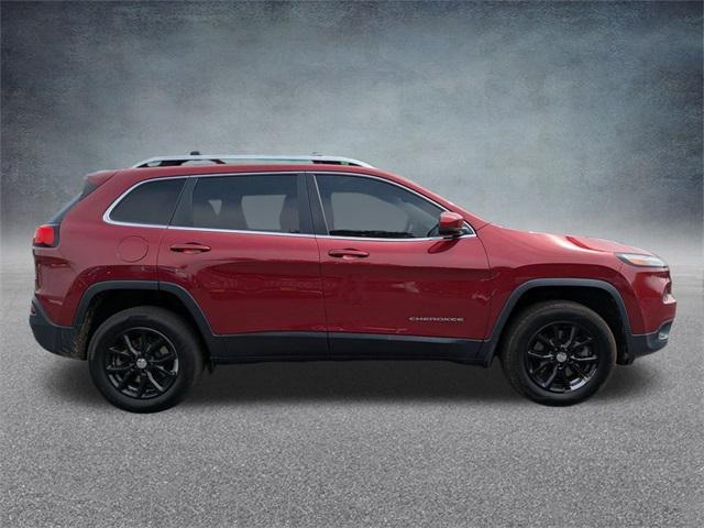 Photo of 2016 Deep Cherry Red Crystal Pearlcoat Jeep Cherokee