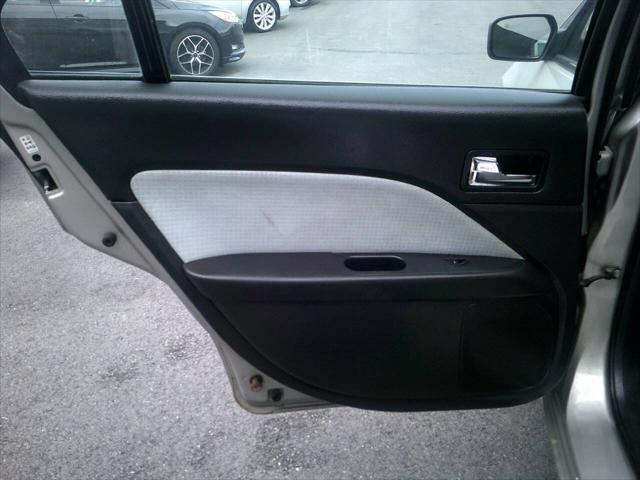 Photo of 2007 Dune Pearl Clearcoat Metallic Mercury Milan