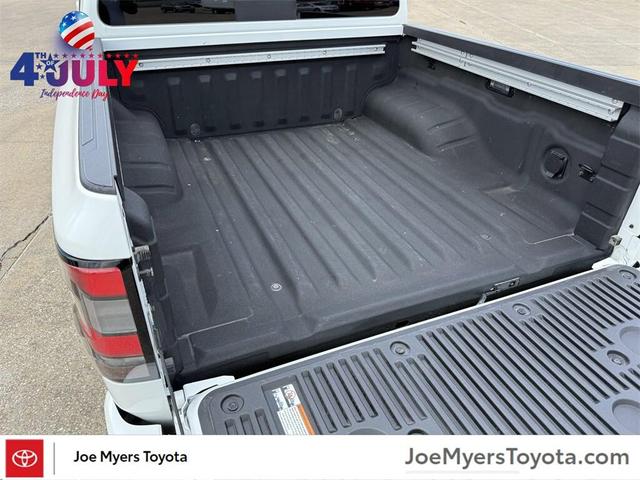 Photo of 2024 Glacier White Nissan Frontier