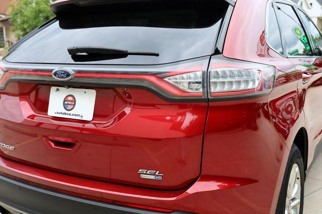 Photo of 2015 Ruby Red Metallic Tinted Clearcoat Ford Edge