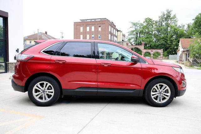 Photo of 2015 Ruby Red Metallic Tinted Clearcoat Ford Edge