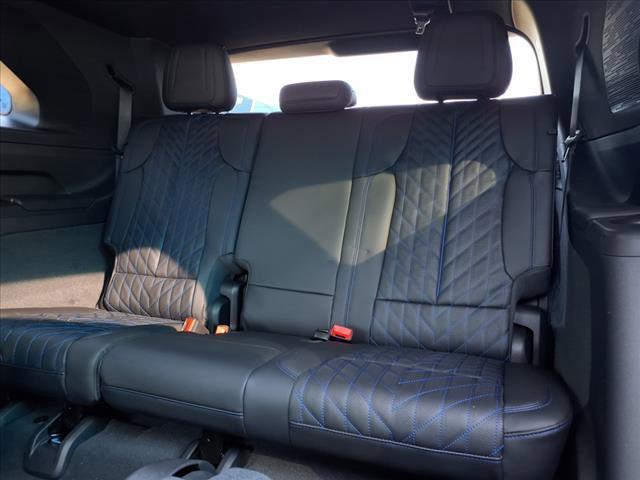 Photo of 2025 Black Raven Cadillac Escalade IQ