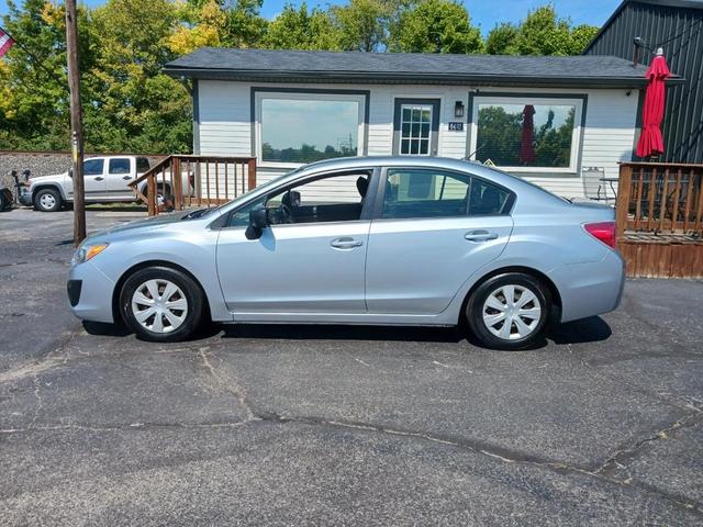 Photo of 2014 Ice Silver Metallic Subaru Impreza