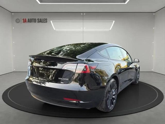 Photo of 2022 Solid Black Tesla Model 3