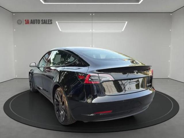 Photo of 2022 Solid Black Tesla Model 3