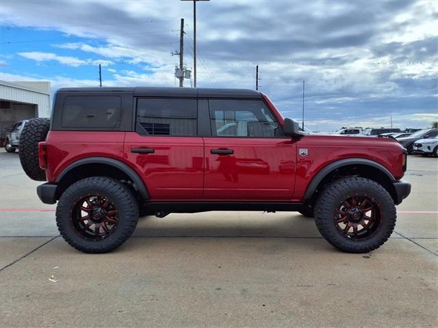 Photo of 2025 Ruby Red Metallic Tinted Clearcoat Ford Bronco