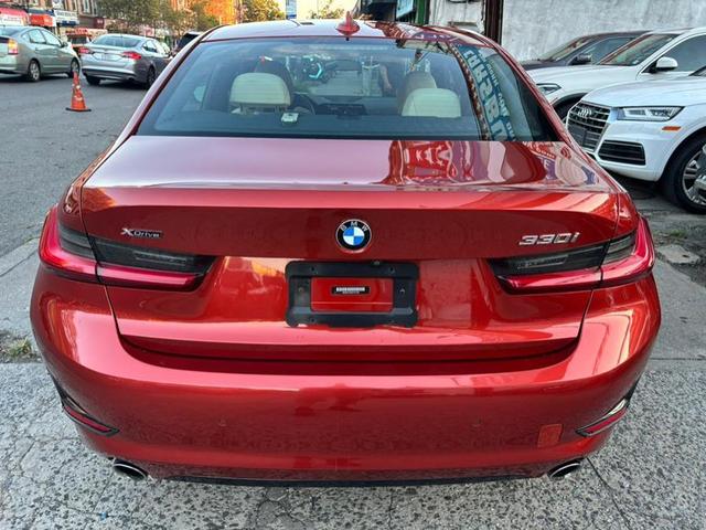 Photo of 2019 Sunset Orange Metallic BMW 330