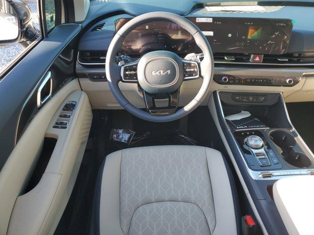 Photo of 2025 Ivory Silver Kia Carnival Hybrid